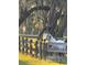 Beautiful white horse standing near a wooden fence on a sunny day at 11064 Ne 212Th Ln, Fort Mc Coy, FL 32134
