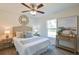 Cozy bedroom with a queen-size bed and ceiling fan at 13351 Sw 83Rd Cir, Ocala, FL 34473