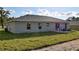 Rear view of a house with sliding glass doors leading to a patio at 13351 Sw 83Rd Cir, Ocala, FL 34473