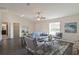 Spacious living area with gray sofas, a coffee table and access to other rooms at 13351 Sw 83Rd Cir, Ocala, FL 34473