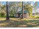 Rustic wooden shed with a green metal roof at 15851 Nw 115Th Ct, Reddick, FL 32686