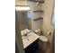 Bathroom featuring vanity with storage, toilet and tiled tub/shower combo at 16510 Se 49Th Street Road, Ocklawaha, FL 32179