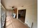 Sunroom featuring walls of windows, letting in lots of natural light, and a ceiling fan at 16510 Se 49Th Street Road, Ocklawaha, FL 32179