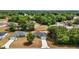 Charming single-Gathering home with well-manicured lawn nestled in a serene, wooded neighborhood at 174 Pine Crse, Ocala, FL 34472
