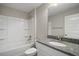 Bathroom with granite vanity, a bathtub-shower combo, and a clean, functional layout, designed for everyday convenience at 174 Pine Crse, Ocala, FL 34472