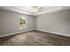 Bright, airy bedroom with wood-look flooring, recessed lighting, and a ceiling fan provides a tranquil retreat at 174 Pine Crse, Ocala, FL 34472
