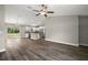 Open-concept living room flowing into the kitchen with stainless steel appliances and ample counter space at 174 Pine Crse, Ocala, FL 34472