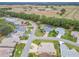 Aerial view of residential neighborhood with houses and landscape at 2117 Sansores St, The Villages, FL 32159
