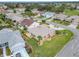 Aerial showcasing home, yard, and surrounding homes at 2117 Sansores St, The Villages, FL 32159