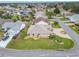 Property view showing house, yard, and neighborhood at 2117 Sansores St, The Villages, FL 32159