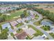 Aerial view of a residential area with houses and green spaces at 2117 Sansores St, The Villages, FL 32159