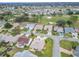 Aerial view of houses in a residential community near a golf course at 2117 Sansores St, The Villages, FL 32159
