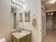 Bathroom with granite vanity and updated fixtures at 2117 Sansores St, The Villages, FL 32159