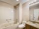 Bathroom with tub, granite vanity, and updated fixtures at 2117 Sansores St, The Villages, FL 32159
