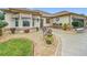 Landscaped front yard with seating area and decorative plants at 2117 Sansores St, The Villages, FL 32159