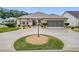 Single-story home with a screened garage and landscaped yard at 2117 Sansores St, The Villages, FL 32159