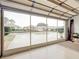 Garage with screen door offering a view of the neighborhood at 2117 Sansores St, The Villages, FL 32159