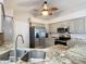 Well-equipped kitchen boasting stainless steel appliances and granite countertops at 2117 Sansores St, Lady Lake, FL 32159