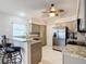 Updated kitchen with granite countertops and stainless steel appliances at 2117 Sansores St, The Villages, FL 32159