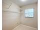 Laundry room with ample shelving for storage at 2117 Sansores St, The Villages, FL 32159