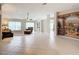 Spacious living room with tiled floors and accent wall at 2117 Sansores St, The Villages, FL 32159