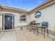 Small patio with bistro set and metal art at 2117 Sansores St, The Villages, FL 32159