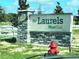 Elegant entrance sign for the Laurels at West Oak with stone accents and a welcoming feel at 2134 Nw 23Rd Loop, Ocala, FL 34475