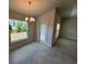 Well-lit dining room featuring tile flooring, large windows, and modern chandelier at 2134 Nw 23Rd Loop, Ocala, FL 34475