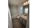 Bright bathroom with a shower-tub combo, neutral walls, and modern sink at 2138 Nw 23Rd Loop, Ocala, FL 34475