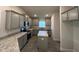 This kitchen features stainless steel appliances, gray cabinets, an island and a window at 2138 Nw 23Rd Loop, Ocala, FL 34475