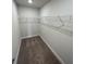 This walk-in closet features neutral walls, carpeted floor and a wire shelf for storage at 2138 Nw 23Rd Loop, Ocala, FL 34475