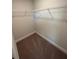 Empty walk-in closet with carpeted floor, white walls and wire shelving at 2138 Nw 23Rd Loop, Ocala, FL 34475