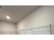 Walk-in closet featuring carpeted floor, neutral walls, and wire shelving at 2138 Nw 23Rd Loop, Ocala, FL 34475