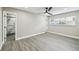 Bright bedroom featuring wood-look flooring and an ensuite bathroom at 622 Aldama Ct, Ocoee, FL 34761