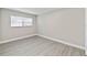 Bright bedroom with wood-look flooring and neutral walls at 622 Aldama Ct, Ocoee, FL 34761