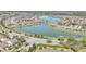 Aerial view of community with lake and homes at 8729 Sw 61St Loop, Ocala, FL 34481