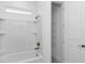 Clean bathroom with a bathtub, shower, and linen closet at 8729 Sw 61St Loop, Ocala, FL 34481