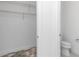 Clean bathroom with toilet and shelving at 8729 Sw 61St Loop, Ocala, FL 34481