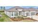 Single-Gathering home with two-car garage and front landscaping at 8729 Sw 61St Loop, Ocala, FL 34481