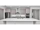 Modern kitchen boasts stainless steel appliances and white quartz countertops at 8729 Sw 61St Loop, Ocala, FL 34481