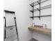 Well-lit storage room with wire shelving and a workbench at 8729 Sw 61St Loop, Ocala, FL 34481