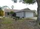 Brick ranch home with attached garage and landscaped yard at 9101 Sw 91St Cir, Ocala, FL 34481