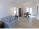 Living room with light flooring and French doors at 9101 Sw 91St Cir, Ocala, FL 34481