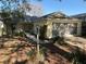 Inviting single-story home with well-maintained landscaping and enclosed porch at 9117 Sw 93Rd Cir, Ocala, FL 34481