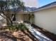 Charming entryway with walkway, landscaping, and room for seating at 9117 Sw 93Rd Cir, Ocala, FL 34481