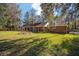 Spacious backyard with mature trees and beautiful brick house at 10249 Nw 21St St, Ocala, FL 34482