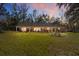 Well-maintained backyard featuring a spacious lawn and outdoor seating at 10249 Nw 21St St, Ocala, FL 34482