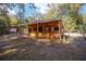 Rustic barn with two stalls and covered porch at 10249 Nw 21St St, Ocala, FL 34482