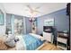 Bedroom with blue bedding and wood flooring at 10249 Nw 21St St, Ocala, FL 34482