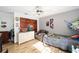 Colorful bedroom with hardwood floors, neutral grey walls, and ceiling fan at 10249 Nw 21St St, Ocala, FL 34482
